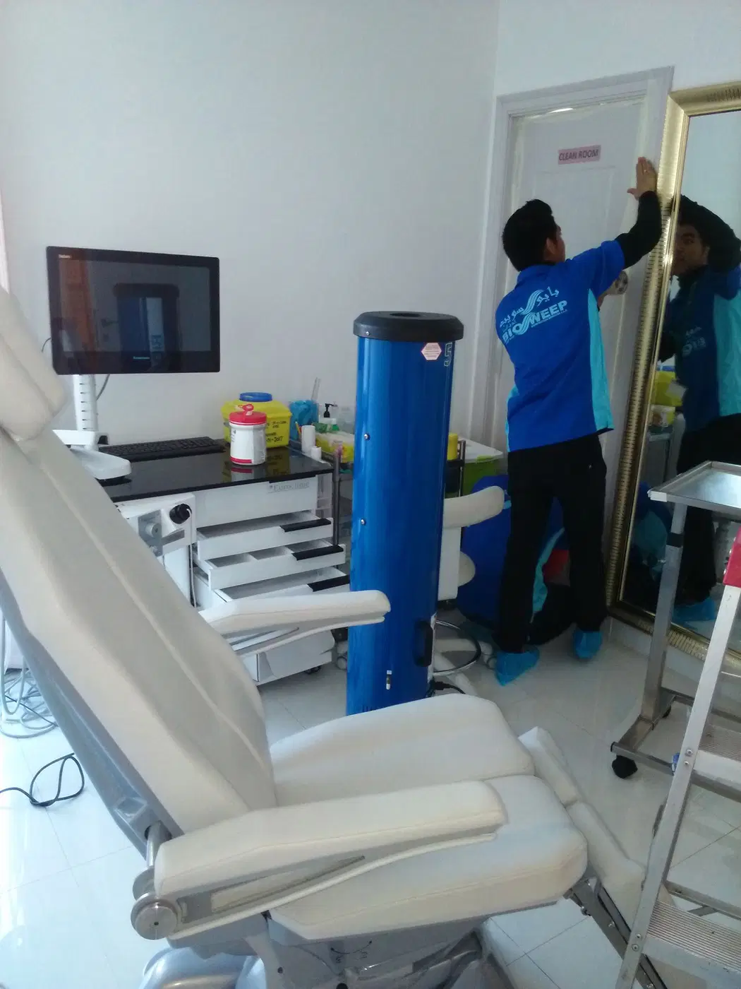 A BioSweep technician in a dental treatment room with professional equipment.